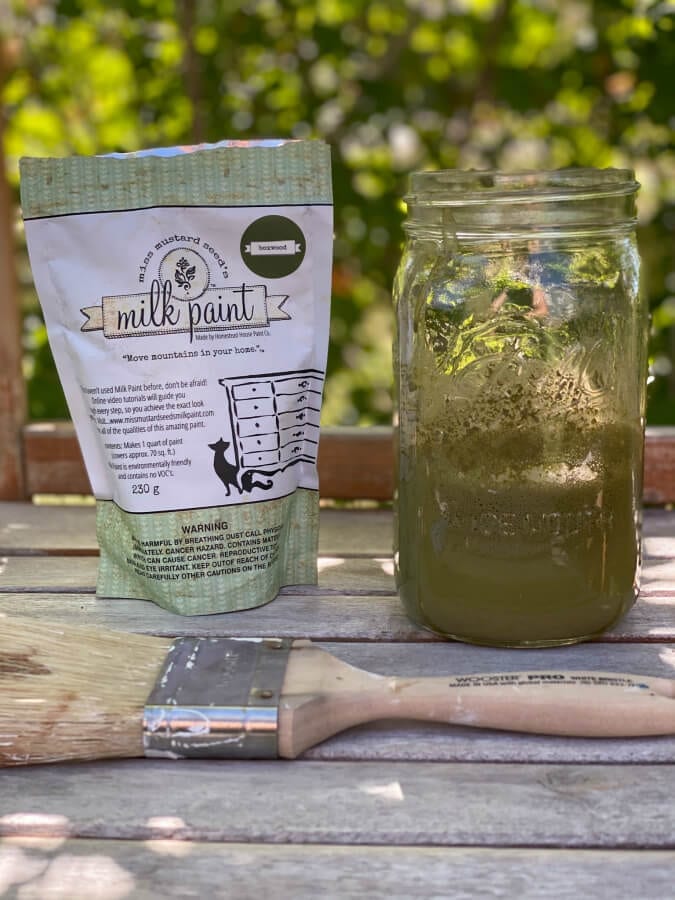 Miss Mustard Seed's Boxwood milk apint brought this weathered potting bench back to life!