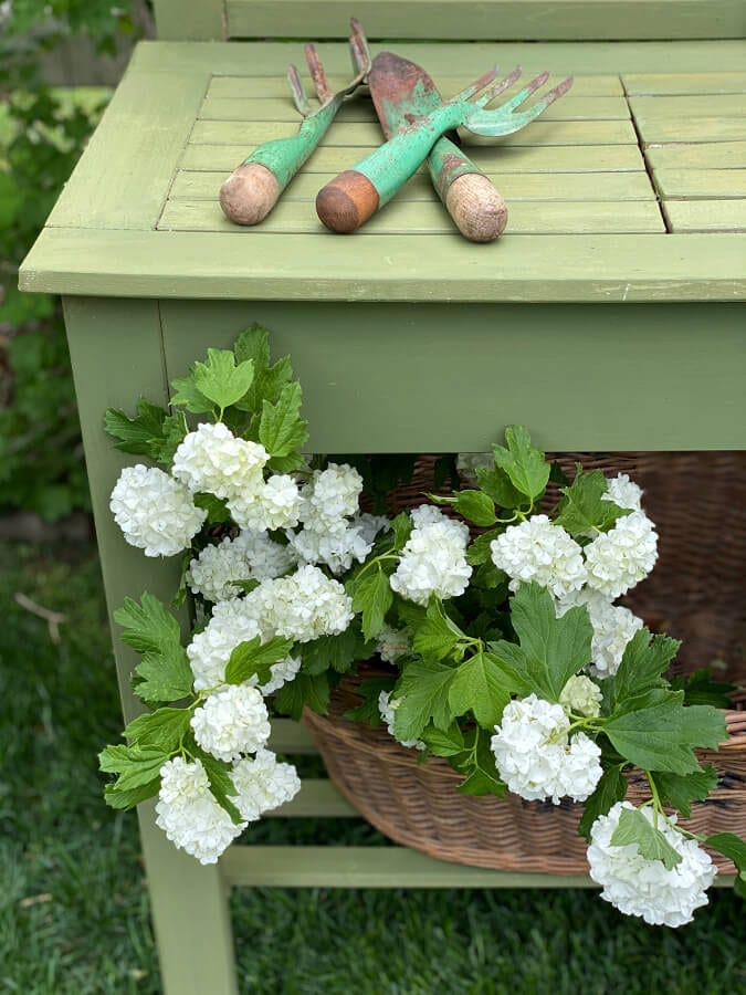 A budget friendly potting bench makeover with Boxwood green.