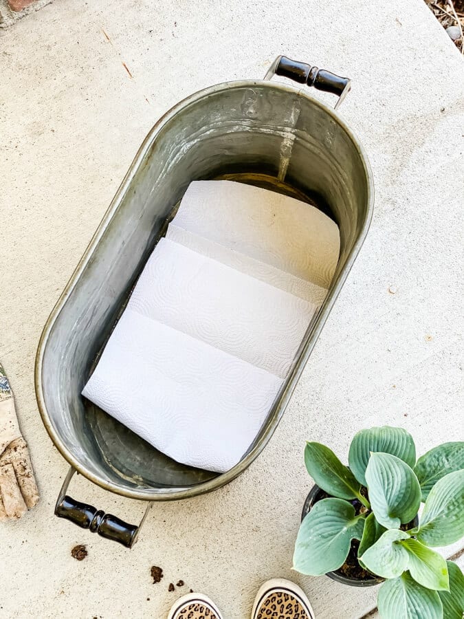Tip_ line your planters with paper towels to act as a barrier so you don't lose your potting soil when you water the plants.