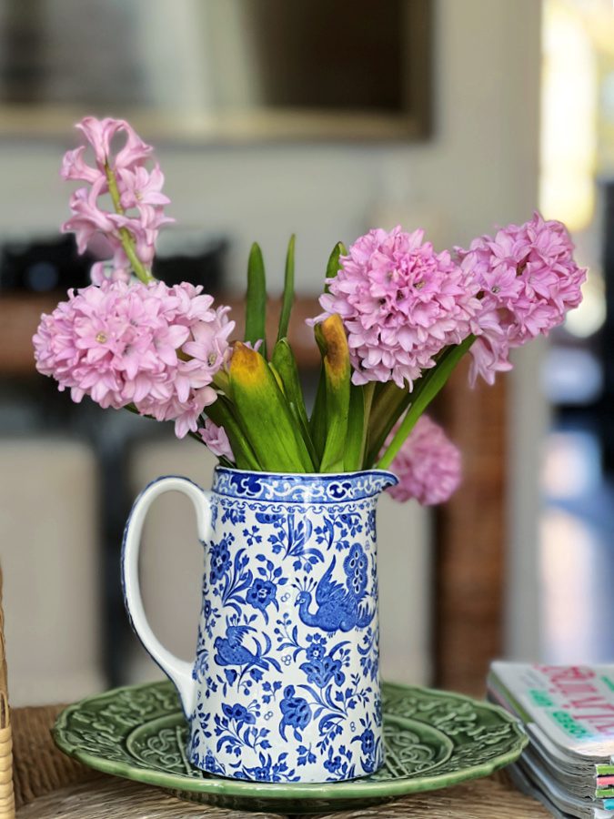 Pink hyacinths in a blue and white Emma Bridgewater pitcher.