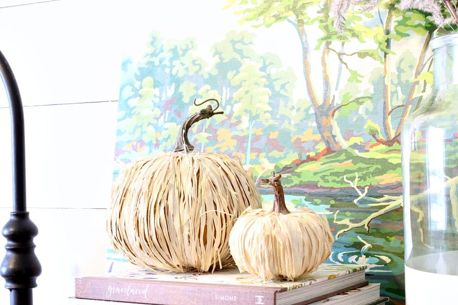Easy and cheap...these DIY raffia pumpkins add that natural flair to your Fall decor.