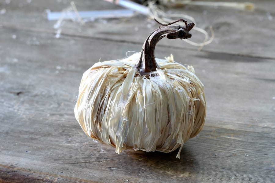 Natural looking DIY raffia pumpkins.