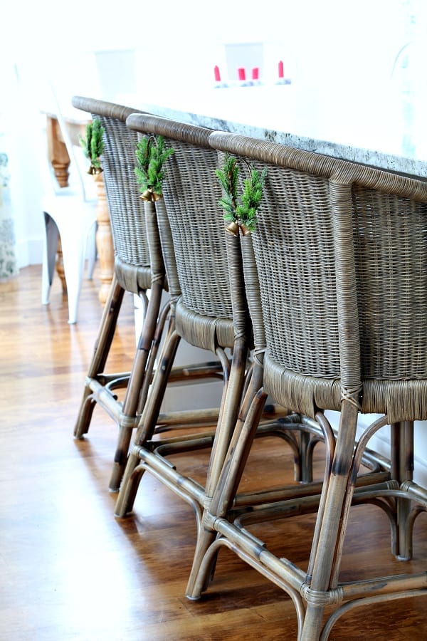 Mini wreaths on the back of your kitchen stools add just the right amount of Christmas cheer.
