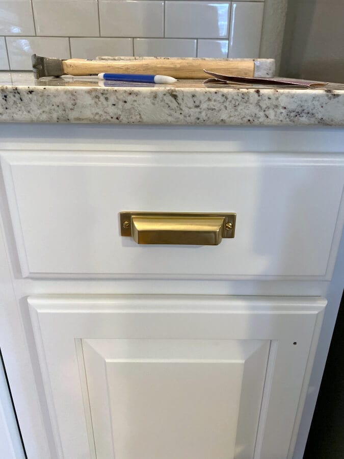 Adding the hardware to our newly refinished cabinets was easy and quick to do!