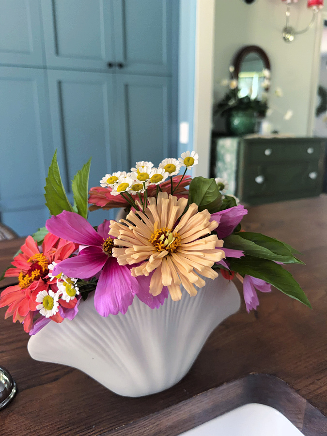 shell vase full of flowers