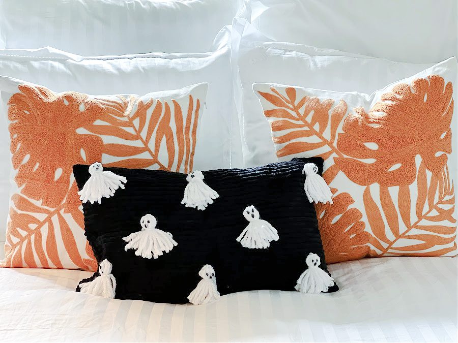 Black pillow with white ghosts