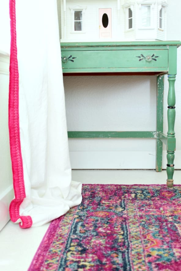 THetse pink and white no sew drop cloth curtains look custom for a fraction of the price!