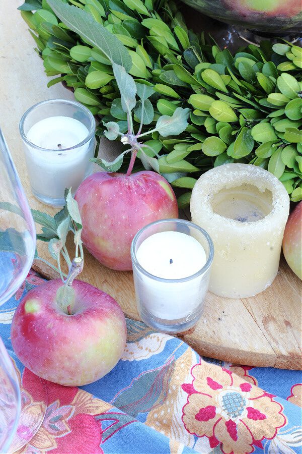 Candles add ambiance to this outdoor tablescape.