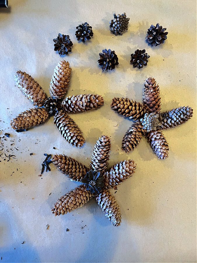 3 starshaped pinecone ornaments