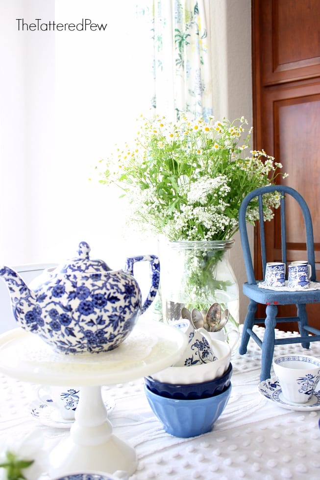 Flowers, vintage touches and blue accents make this tea party a pretty one.