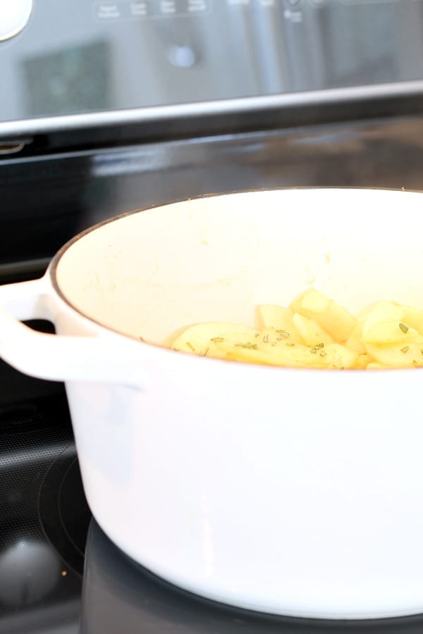 Apples cooking in browned butter and rosemary.