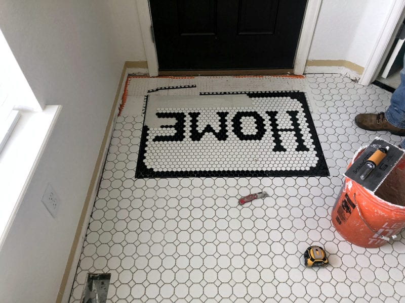 A vintage inspired tiled door mat.