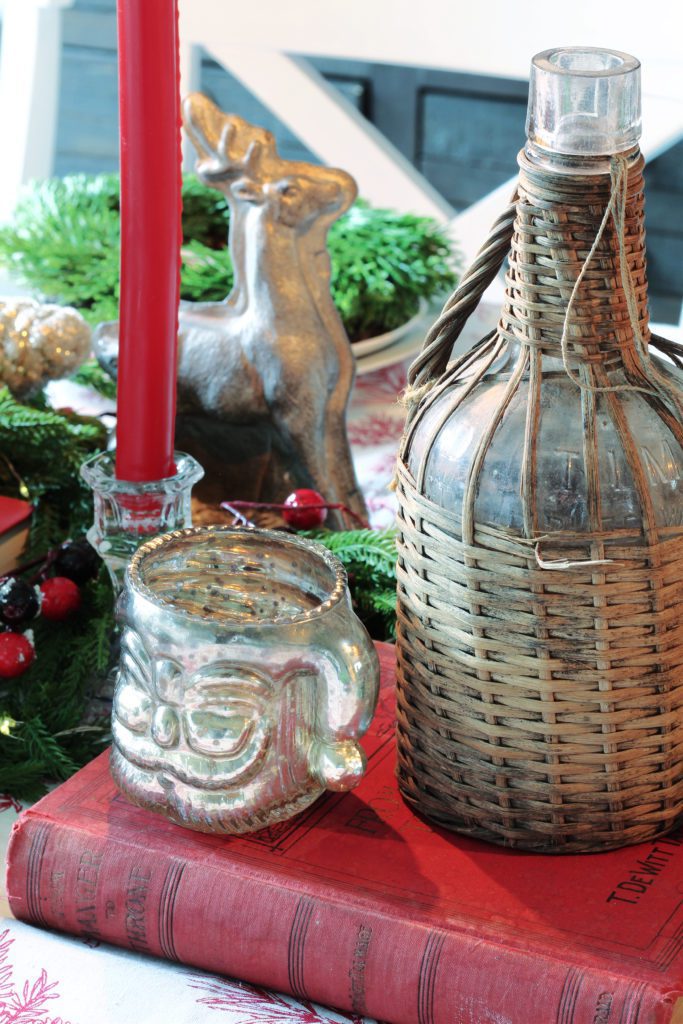 Mercury glass santas and wcker demi johns for vintage Christmas table decor.