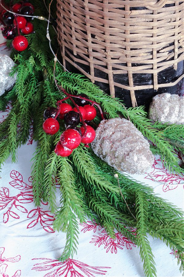 Faux greenery and berries jazz up any Christmas table!