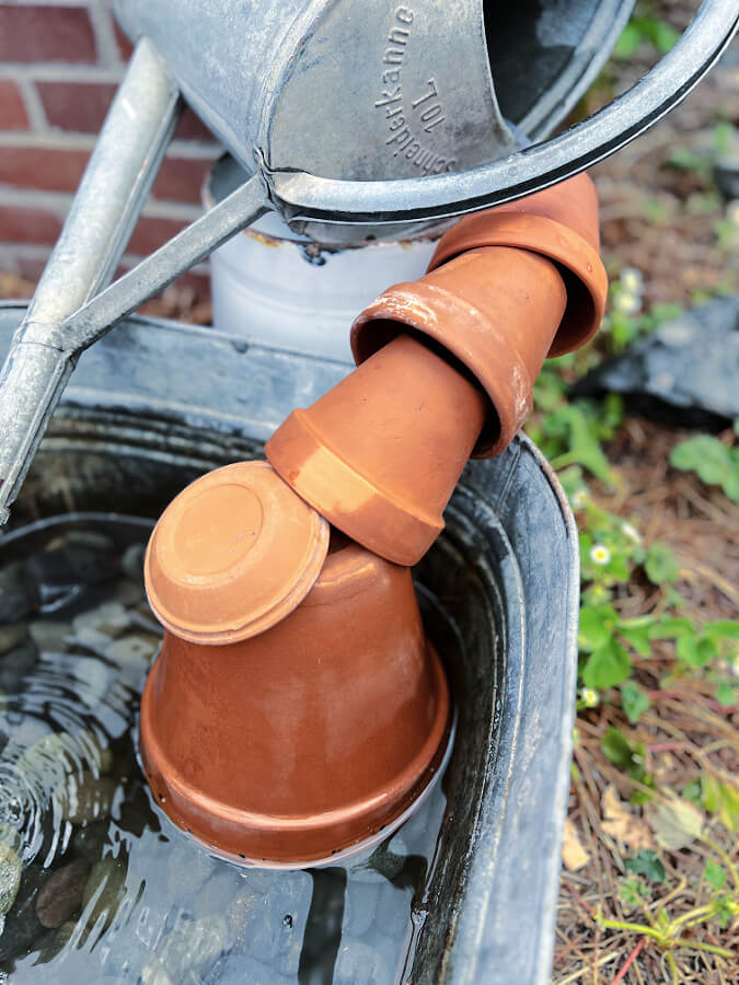 clay pots for watering can fountain