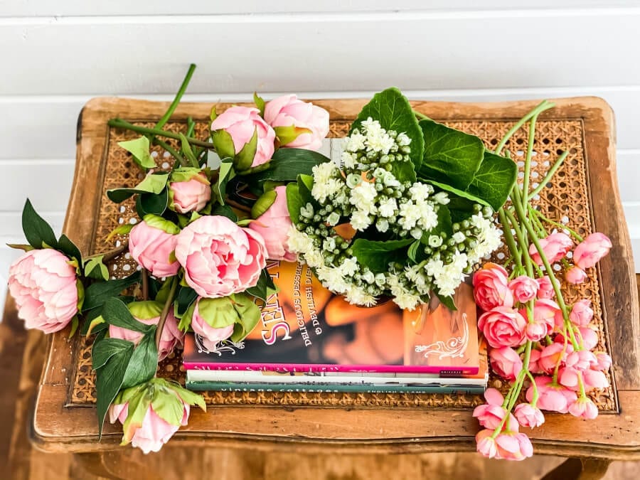 Gathering faux flowers to create a colorful arrangement!