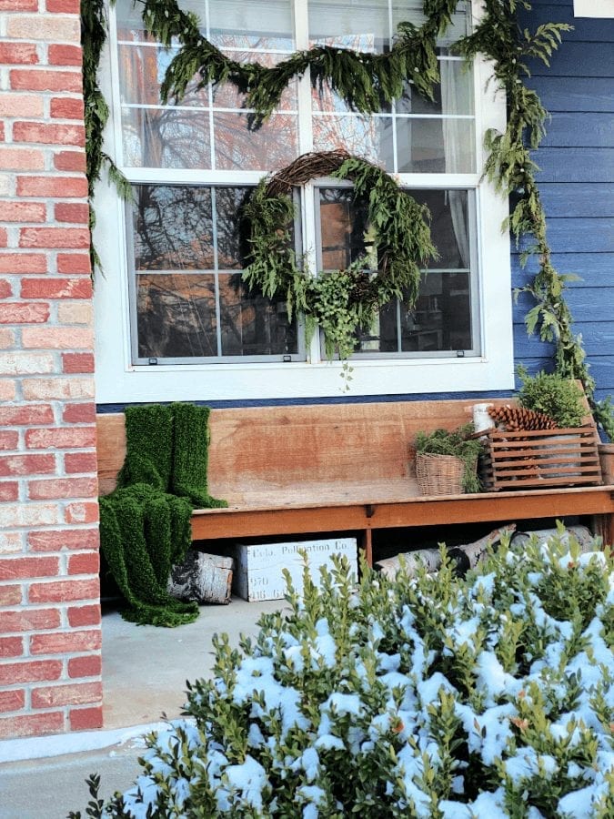 Winter porch ideas that include keeping up your greenery!