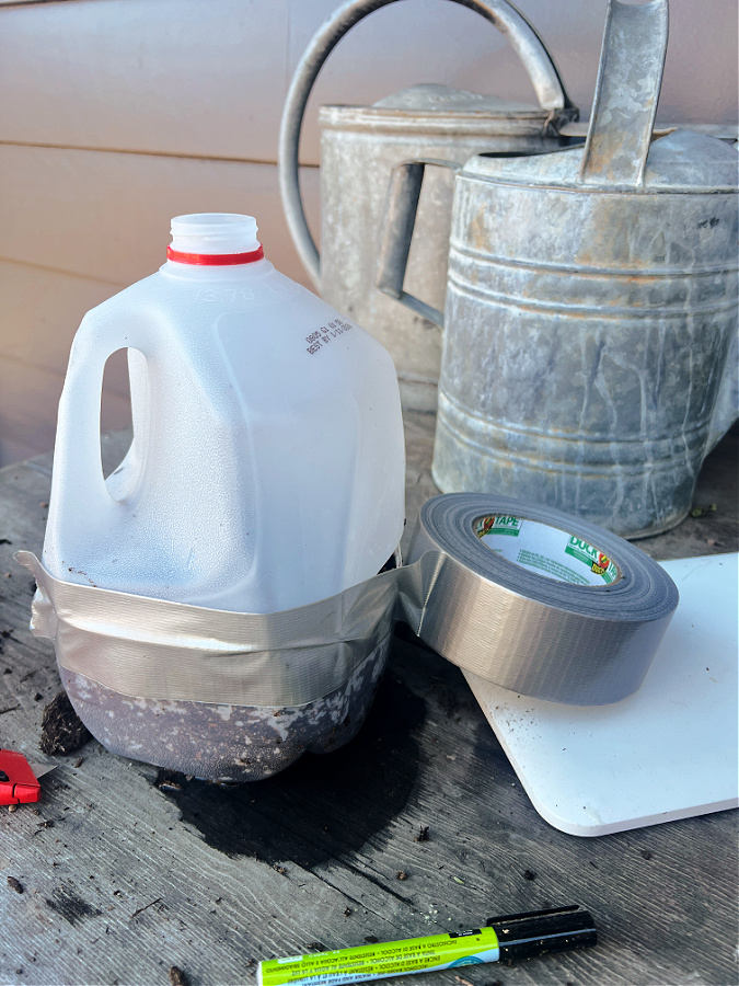 close up milk jugs with duct tape