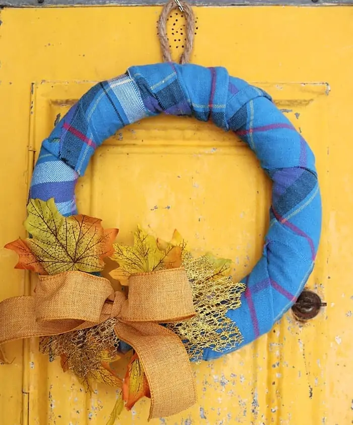 Wreath wrapped with blue flannel for fall